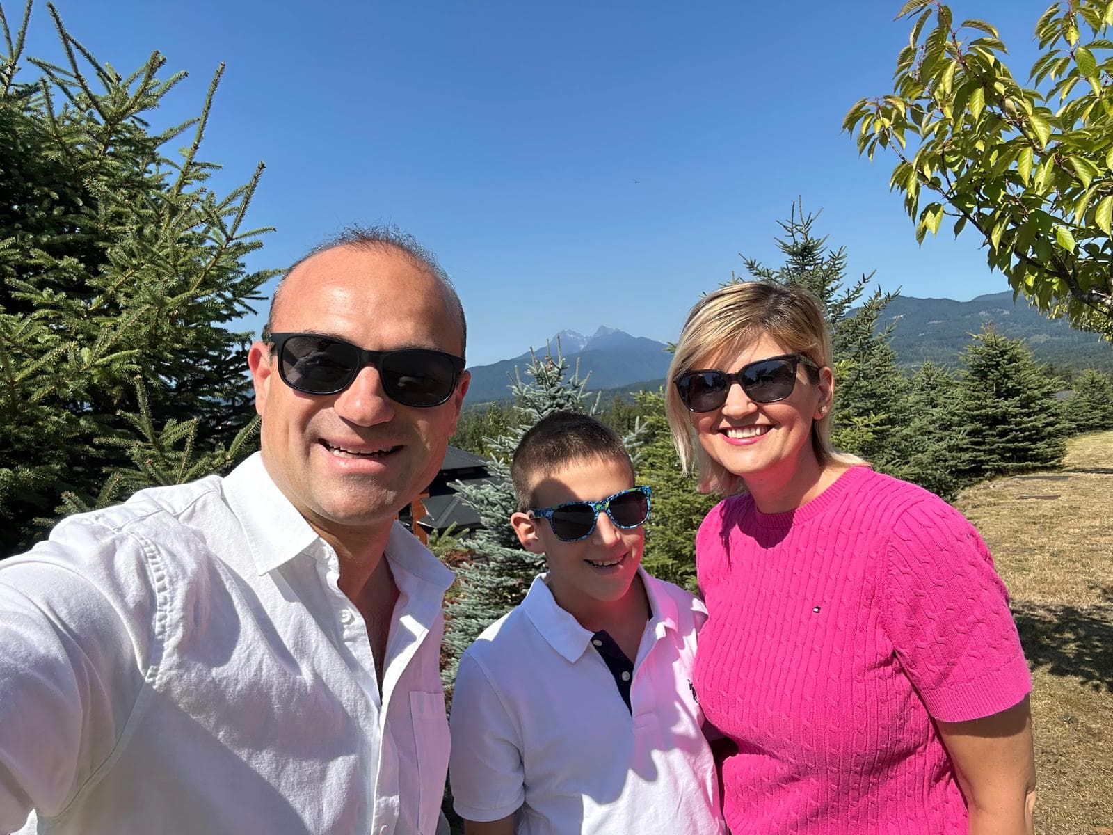 Silviu Manolescu with his wife Irina and son Victor at Grant Hill in Maple Ridge, with the Golden Ears mountains behind them.